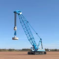 Construction Site With Blue Crawler Crane Lifting Weight Under Clear Sky