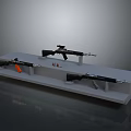 Different Weapons Display On Stand With Three Guns Bullets And Orange Component