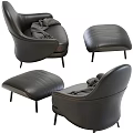 Modern Black Leather Lounge Chair With Ottoman And Cozy Throw Blanket