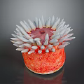 Vibrant Marine Sea Anemone With Orange Red Base White Tentacles and Pink Center