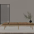 Light Brown Upholstered Bed Bench With Wooden Legs Sunlight Shadows And Plant In Black Vase