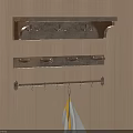 Three Wall Mounted Racks With Hooks Hanging On Wooden Wall And Towel