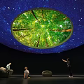 Visitors Enjoy Museum Exhibition With Circular Forest View And Starry Sky