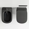 Sleek Black Wall Mounted Toilet With Matching Sink And Modern Faucet In Bathroom