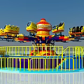 Colorful Rotating Amusement Ride with Multiple Seats Decorative Top Blue Platform and Yellow Railings