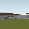 Modern Curved Building Featuring Streamlined Roof Metal Panels And Blue Water Feature On Lawn