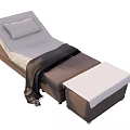 Comfortable Upholstered Massage Bed With Gray Pillow Black Throw Blanket And Footrest