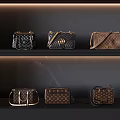 Elegant Handbags Displayed On Shelves With Quilted Leather And Chain Straps