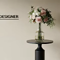 Designer Floral Arrangement With Pink White Flowers In Clear Glass Vase On Black Round Table