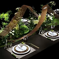 Elegant Banquet Hall Table Setting With Lush Greenery Decorative Wooden Structures And White Plates