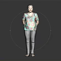 Woman In Colorful Floral Top And Black Pants Standing Against Dark Background