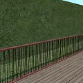 Red Railing Fence Along Green Hedge Wall With Wooden Deck Floor