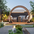 Courtyard Garden With Circular Wicker Arch Wicker Seating And Table Lush Greenery And Colorful Flowers