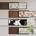 Textured Abstract Paintings With Brown White Black Tones Wall Mounted Artworks And Green Plant