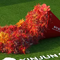 Red Cone Shaped Floral Decor With Red Orange Flowers On Green Lawn XINJUN White Text