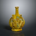 Yellow Ceramic Vase With Intricate Carved Patterns And Decorative Handles