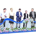 Elegant Blue Launch Device At Ceremony With Flower Decorations And People Standing Around