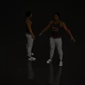 Man In Black Tank Top With Printed Design Gray Sweatpants White Sneakers And Red Waistband