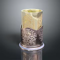 Intricate Sculptural Carving With Silver Floral Patterns And Gold Interior Cylindrical Holder