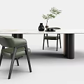Modern Marble Top Dining Table With Black Legs Green Chairs And Black Vase Green Plant