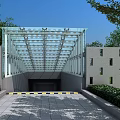 Glass Roof Entrance With Gray Walls Small Windows Warning Stripes Green Shrubs And Blue Sky