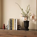 Decorative Accessories Set With Books Black Vase Pink White Flowers On Wooden Console Table