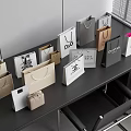 Assorted Stylish Shopping Bags in Various Colors with Logos and Patterns on Dark Desk