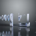 Silver Metal Mechanical Parts With Circular Square And Cylindrical Structures On Dark Reflective Surface