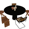 Round Dining Table Set With Dark Gray Top Black Legs Wooden Chairs And Decorative Items