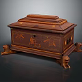 Antique Wooden Storage Chest With Carved Decorations And Claw Feet Design