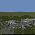 Modern Industrial Factory Buildings with White Roofs Green Trees and Storage Tanks