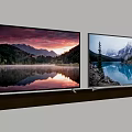 Two Wall Mounted TVs Displaying Natural Scenery With Mountains And Lake