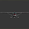 Small Model Airplane With White Wings Red Tail And Green Cockpit Design