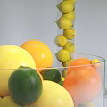 Fresh Mixed Citrus Fruits in Glass Bowl with Lemons Limes and Oranges Stacked in Columns