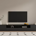 Black TV Stand with Flat Screen TV Decorative Vase Books and Lemon Bowl