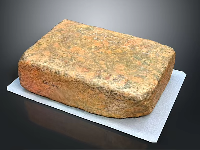 Natural Stone Block Featuring Rustic Brown Green Surface Texture On White Pad 3d model