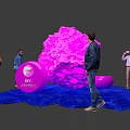 People Interacting With Pink Installation And IBC Amsterdam Logo On Blue Carpet