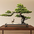 Decorative Ornament Set With Bonsai Pine Tree And Deer Figurine On Wooden Table