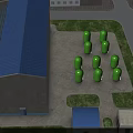 Industrial Factory Building With Blue Roof Green Cylindrical Storage Tanks And Surrounding Grassland Pathways