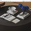 Open Books and Magazines on Dark Wooden Table with White Bowl and Blue Hydrangeas