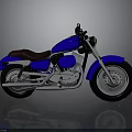 Blue Cruiser Motorcycle With Brown Seat Silver Exhaust Pipes And Silver Wheels