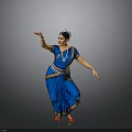 Woman Performing Traditional Indian Dance In Blue Sari With Red Shoes And Ornaments