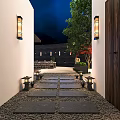 Homestay Building Entrance With Stone Path White Walls Lantern Lamps And Green Trees At Night