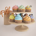 Colorful Frosted Cupcakes On Two Tiered Stand With Assorted Decorations And Candy Canes