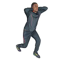 Man In Dark Tracksuit Jumping With Hands Behind Head On Gray Background