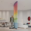 Vibrant Striped Column In Modern Interior Design With Sofa Stools And Wooden Flooring