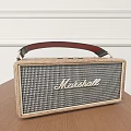 Marshall Portable Speaker With Wooden Frame Leather Handle On Wooden Table White Wall Background