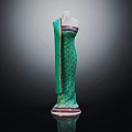Elegant Green Long Dress With Geometric Pattern On Mannequin And Floor Reflection