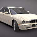 Beige Luxury Sedan XJ Model With Sleek Design And Chrome Grille