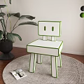 Stylish White Single Chair With Red Trim On Round Rug Near Green Plant And Magazine